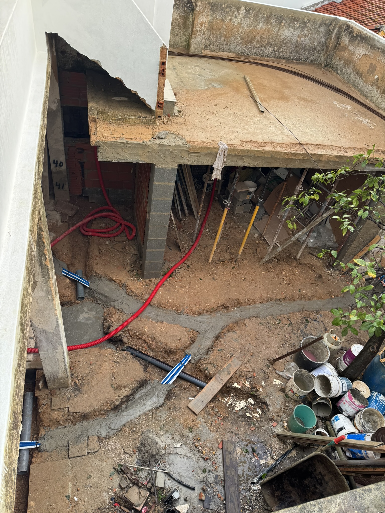 trenches for new plumbing and AC