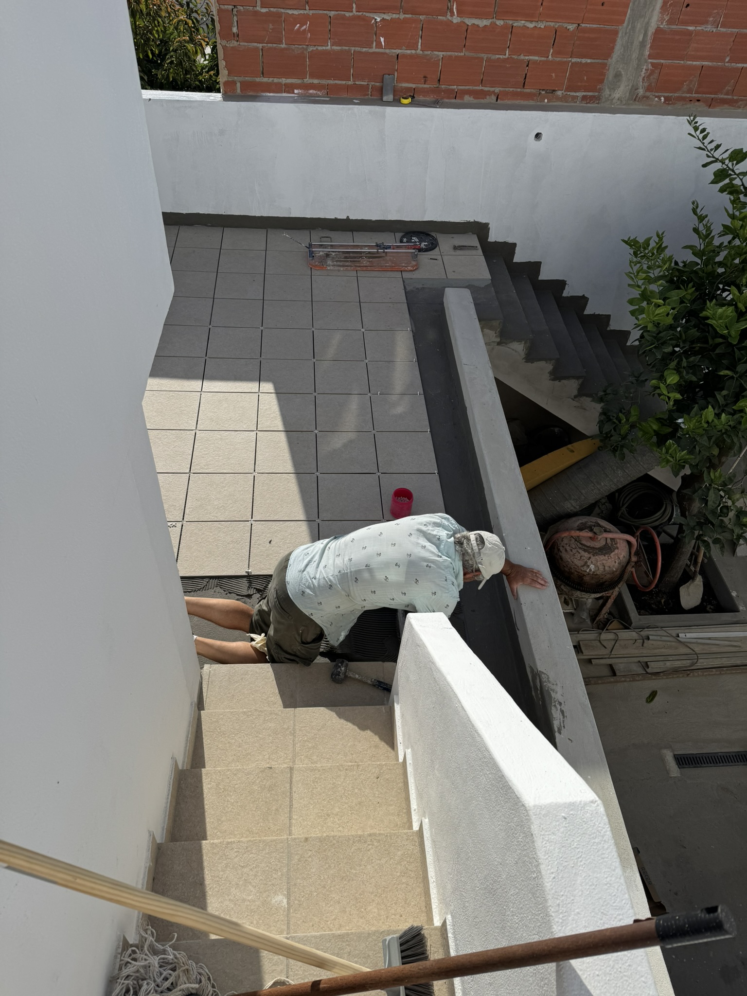 Tiles going on mezzanine terrace