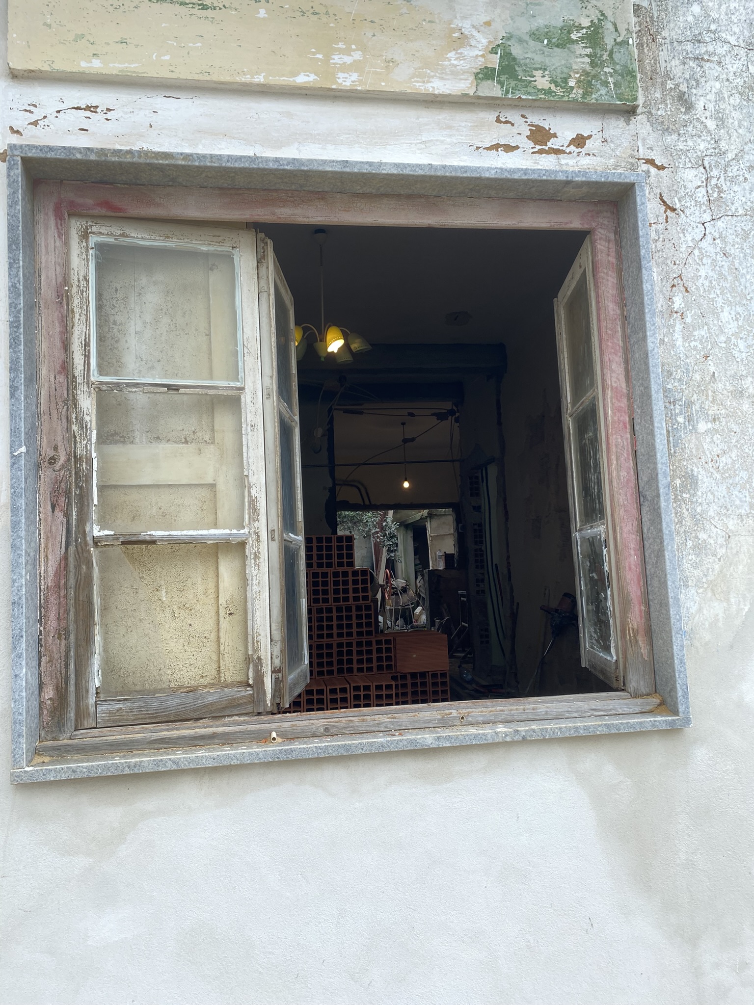 Street look through the living room, kitchen and backyard under construction